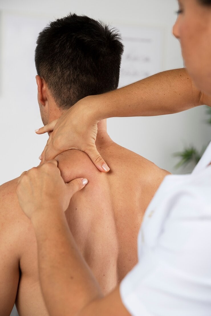 Patient receiving chiropractic therapy for back pain at Blair Chiropractic & Massage Therapy in Barrie
